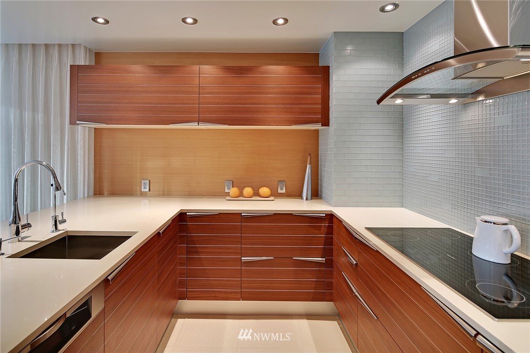 177 107th Avenue Northeast, Unit 1202 Bellevue, WA 98004 - Photo 11 of 25 a bathroom with a sink and a bathtub