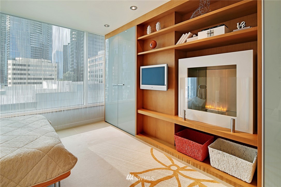 177 107th Avenue Northeast, Unit 1202 Bellevue, WA 98004 - Photo 19 of 25 a living room with a large window and a rug