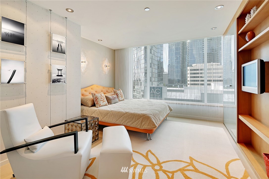 177 107th Avenue Northeast, Unit 1202 Bellevue, WA 98004 - Photo 20 of 25 a bedroom with furniture and a large window