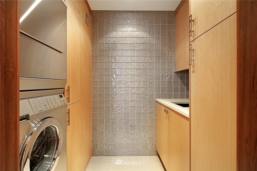 177 107th Avenue Northeast, Unit 1202 Bellevue, WA 98004 - Photo 24 of 25 a bathroom with a bathtub and a shower