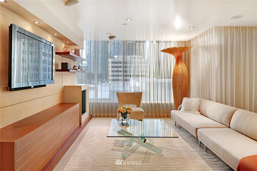 177 107th Avenue Northeast, Unit 1202 Bellevue, WA 98004 - Photo 4 of 25 a living room with furniture and a couch