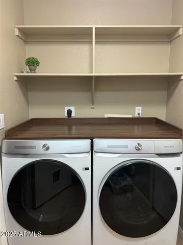 a utility room with a washer and dryer