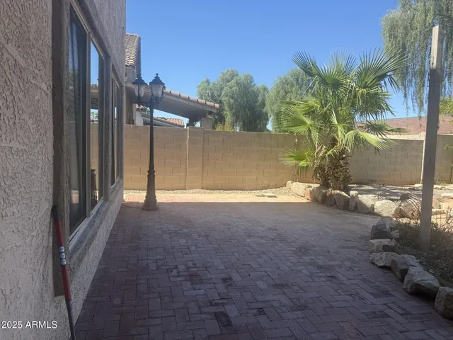 a view of backyard of a house