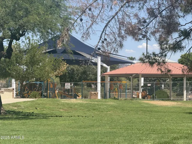 a view of a chairs and a table in a patio