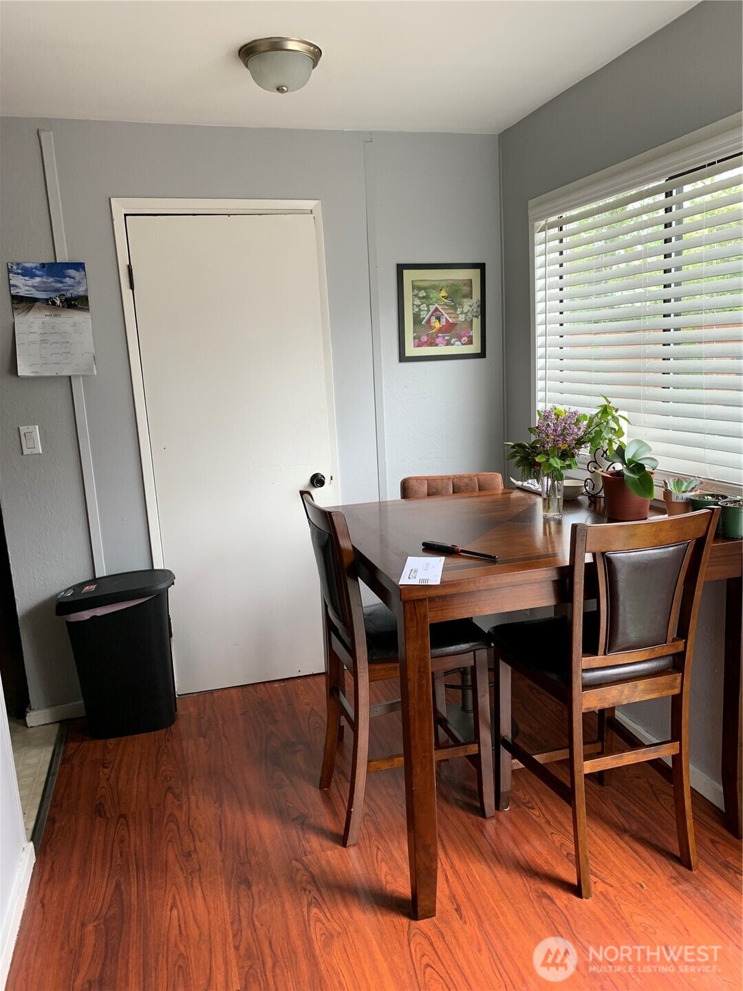 1429 Kirkland Avenue Northeast Renton, WA 98056 - Photo 12 of 19 a dining room with furniture and wooden floor