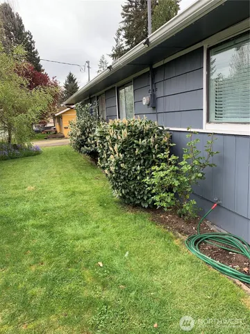 a backyard of a house with lots of green space