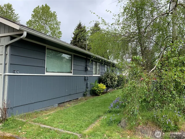 a backyard of a house with lots of green space