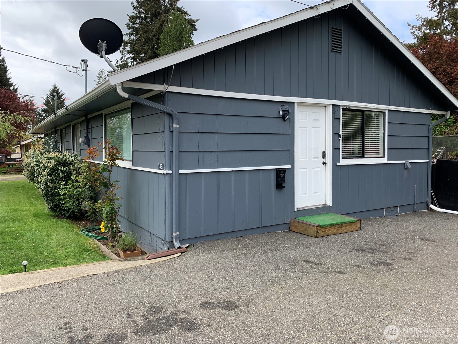 1429 Kirkland Avenue Northeast Renton, WA 98056 - Photo 17 of 19 a backyard of a house with plants and barbeque oven