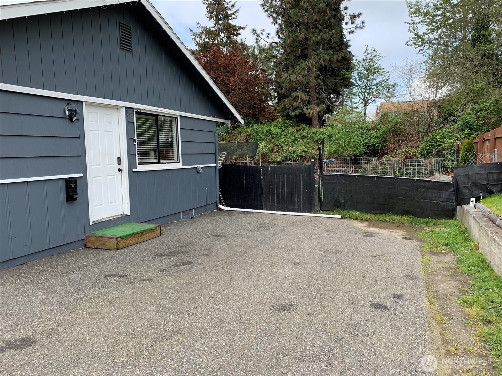1429 Kirkland Avenue Northeast Renton, WA 98056 - Photo 18 of 19 a front view of a house with a yard