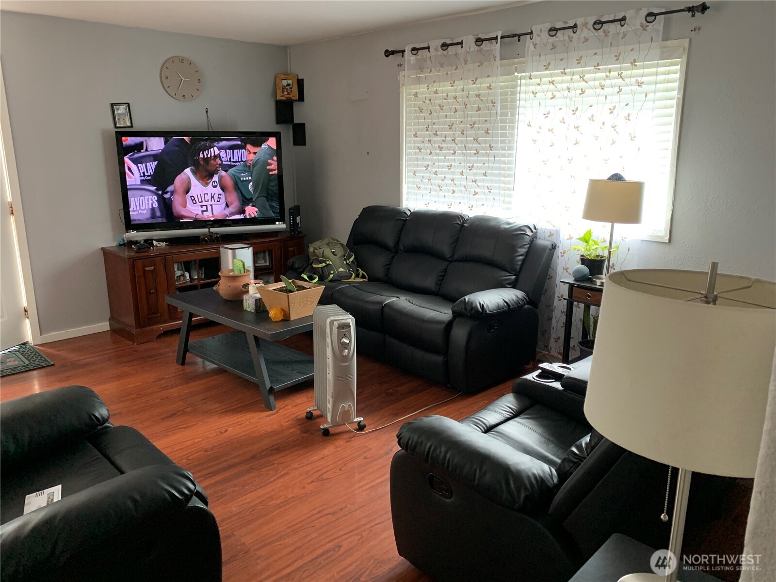 1429 Kirkland Avenue Northeast Renton, WA 98056 - Photo 5 of 19 a living room with furniture a flat screen tv and a large window