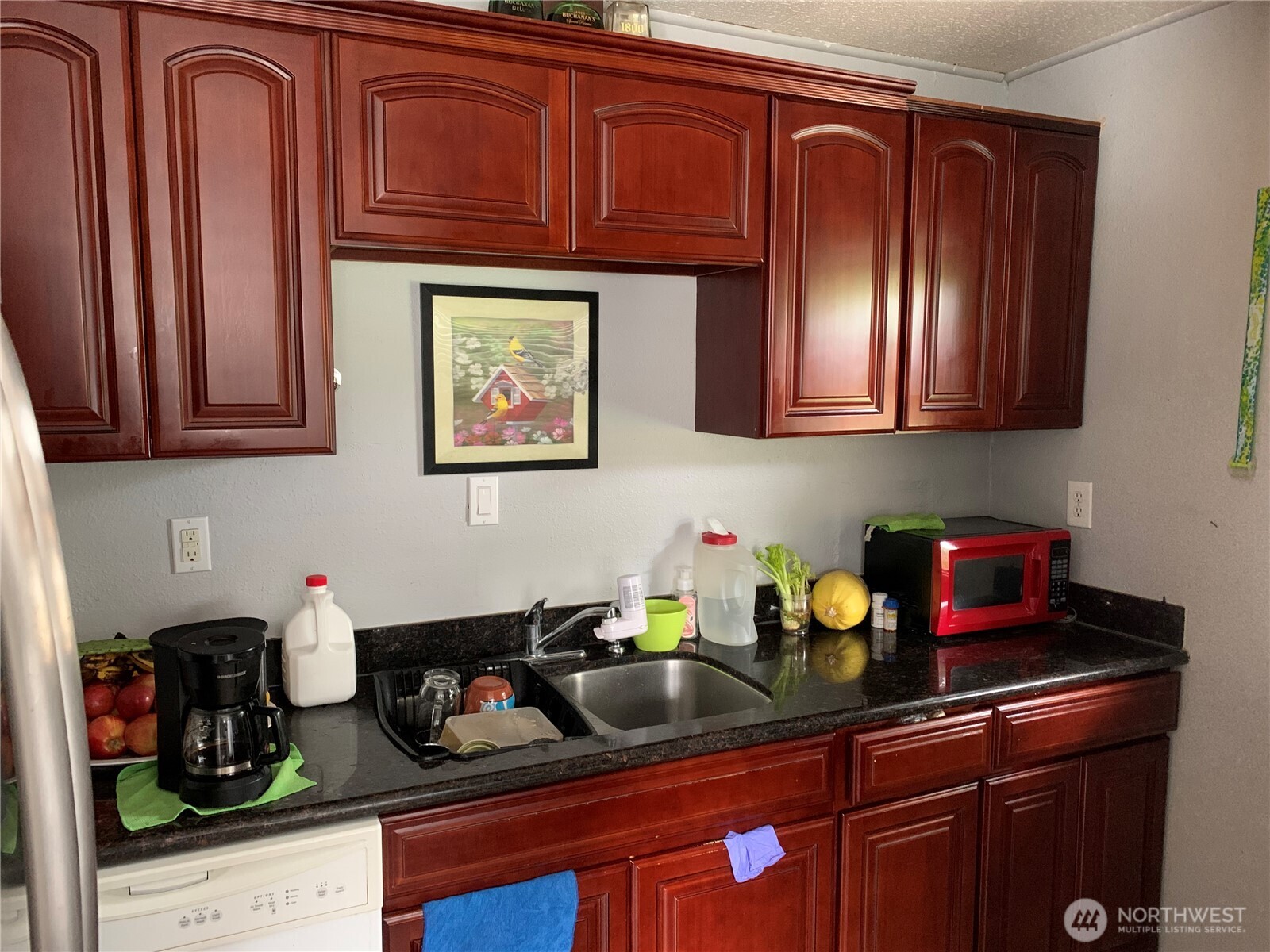 1429 Kirkland Avenue Northeast Renton, WA 98056 - Photo 9 of 19 a kitchen with stainless steel appliances granite countertop a sink dishwasher stove and cabinets