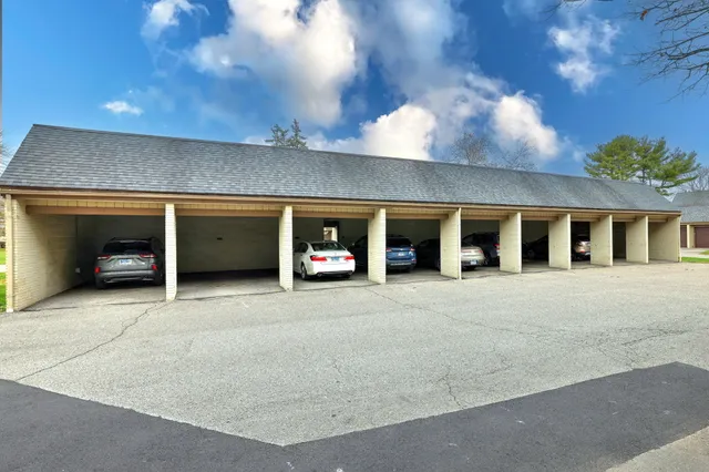 a couple of cars parked in parking area of building