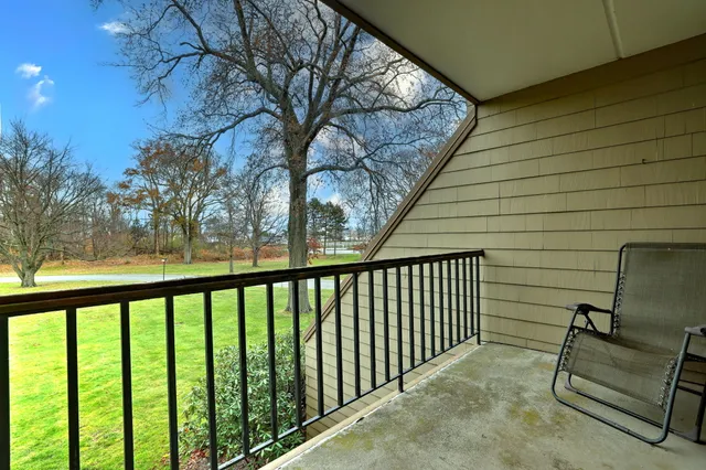 a view of balcony with furniture