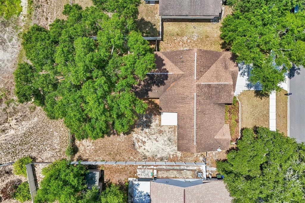 2596 Alclobe Circle Ocoee, FL 34761 - Photo 61 of 70 an aerial view of a house with a yard and large trees