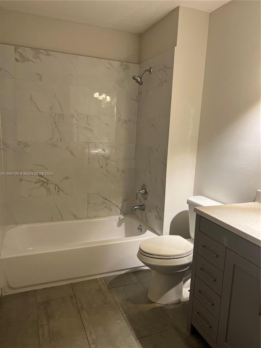 2228 Southwest 80th Terrace, Unit 2228 Miramar, FL 33025 - Photo 12 of 18 a bathroom with a toilet and a bathtub