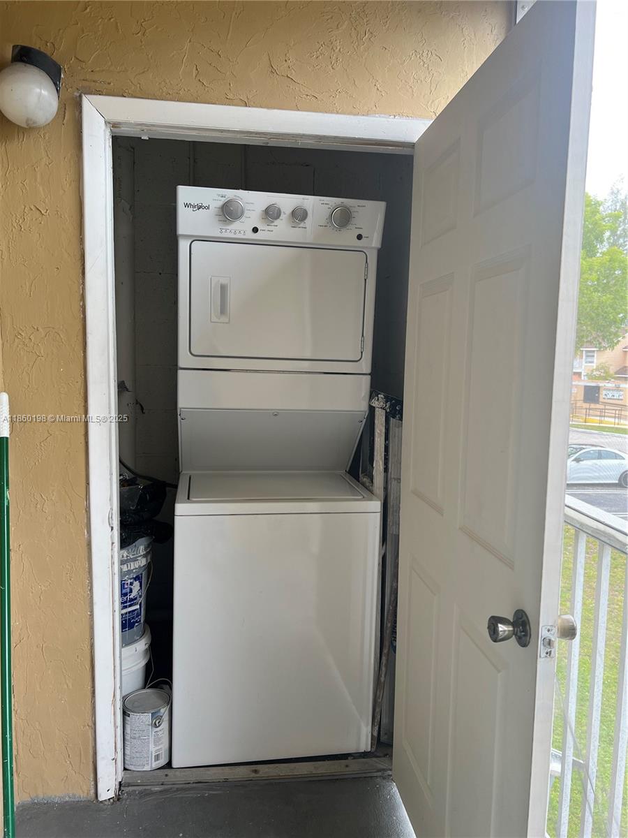 2228 Southwest 80th Terrace, Unit 2228 Miramar, FL 33025 - Photo 16 of 18 a utility room with dryer and washer