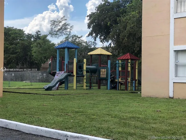 a view of a house with a backyard porch and sitting area