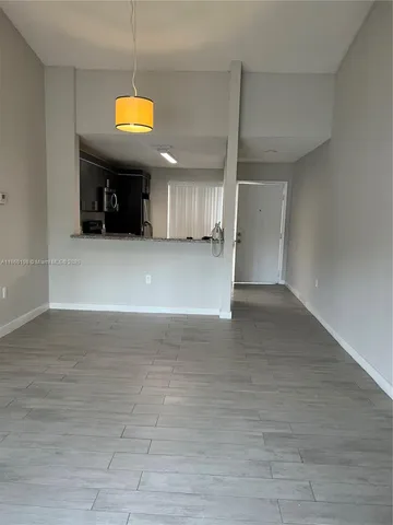 a view of a livingroom with a furniture and window
