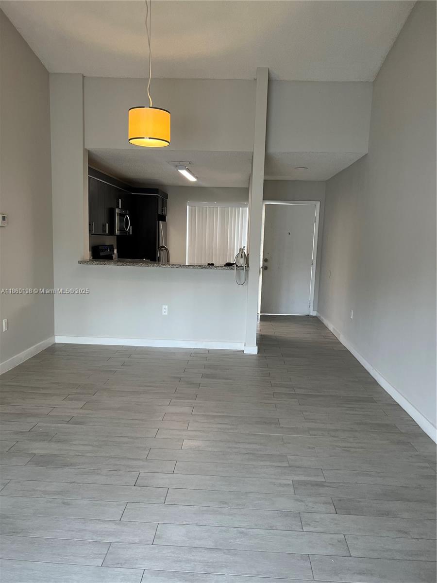 2228 Southwest 80th Terrace, Unit 2228 Miramar, FL 33025 - Photo 7 of 18 a view of a livingroom with a furniture and window