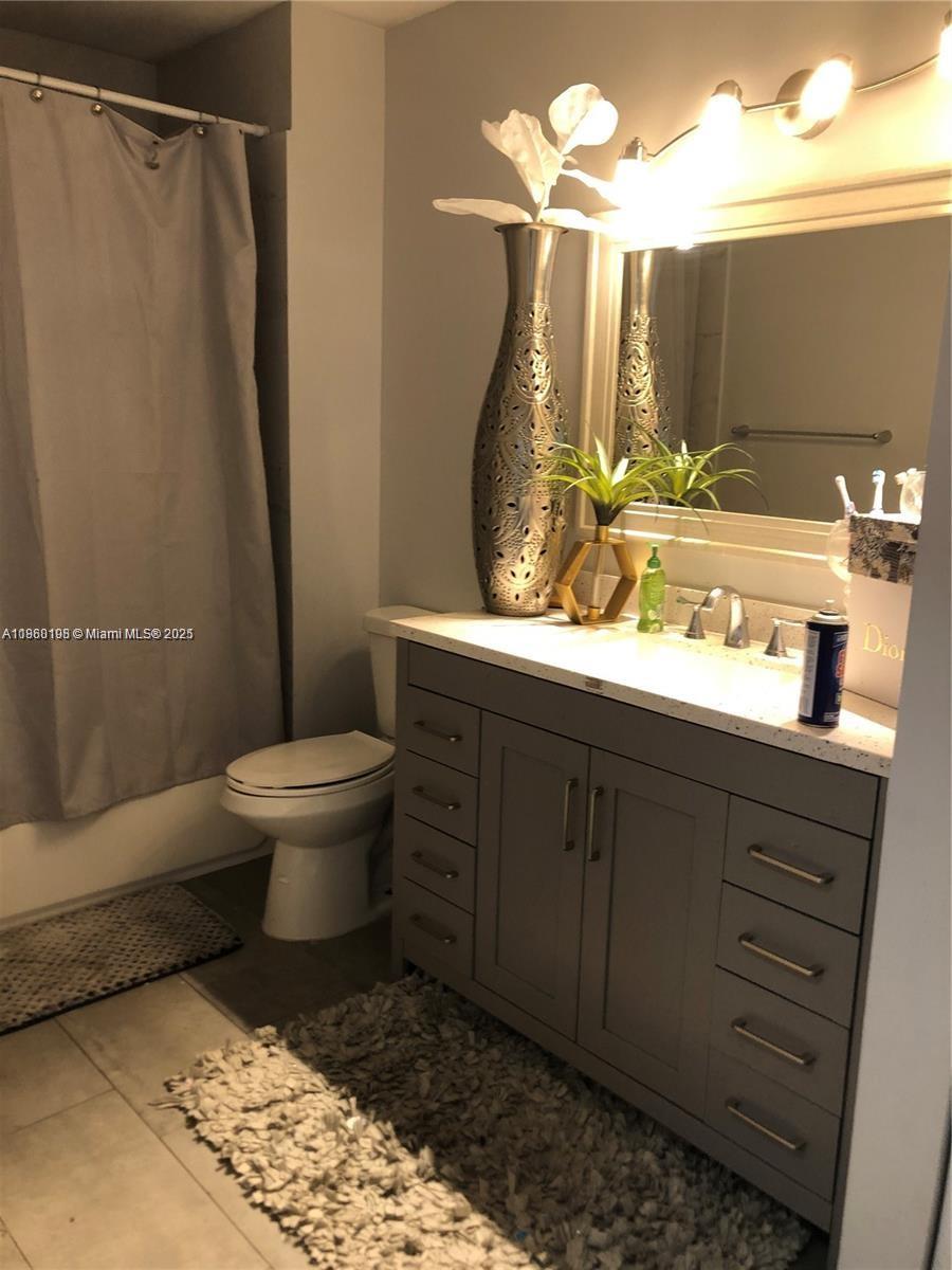 2228 Southwest 80th Terrace, Unit 2228 Miramar, FL 33025 - Photo 10 of 18 a bathroom with a sink toilet and shower