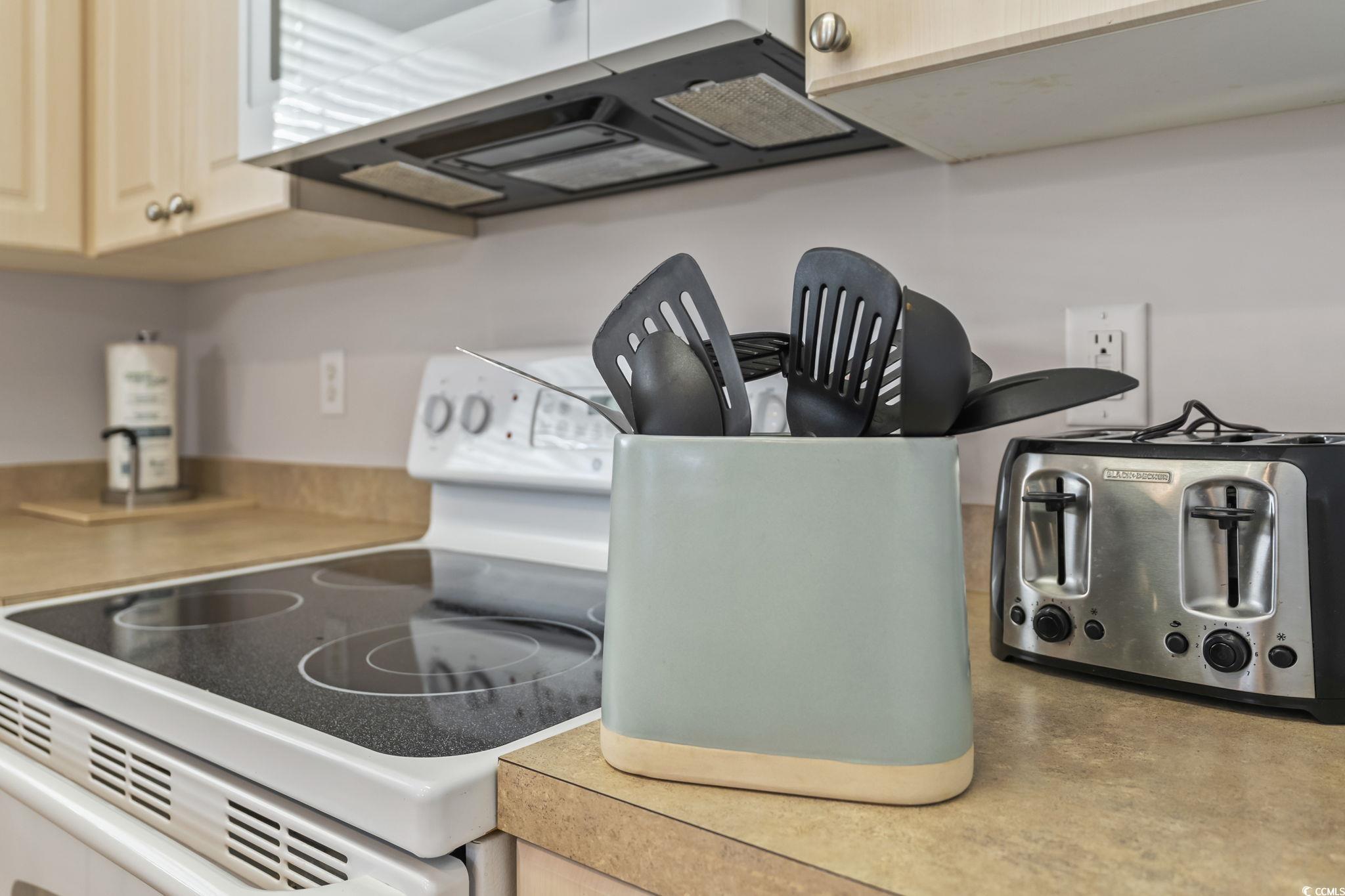 4821 Luster Leaf Circle, Unit 105 Myrtle Beach, SC 29577 - Photo 18 of 40 Kitchen view of electric range, stainless steel microwave, and light countertops