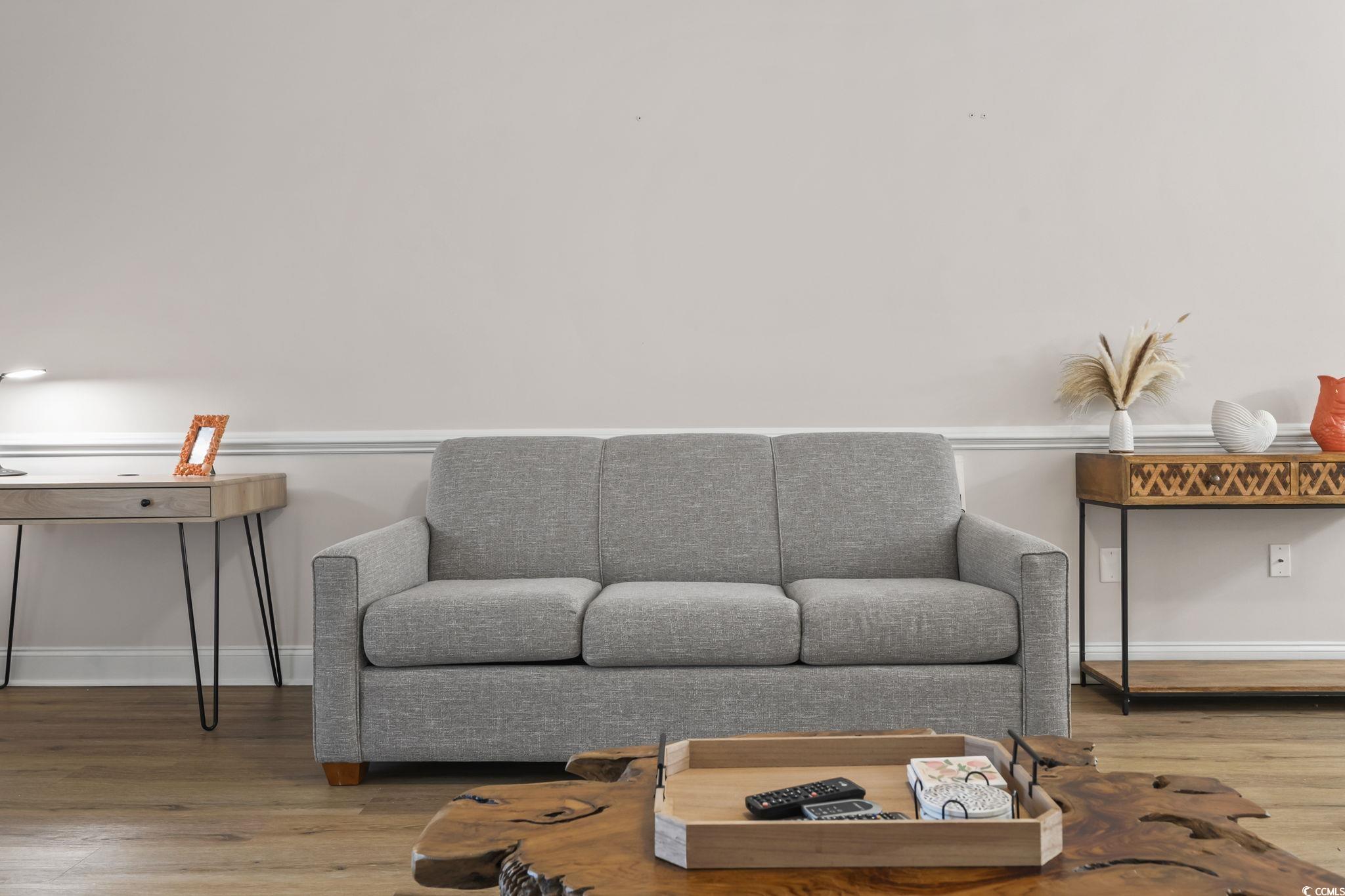 4821 Luster Leaf Circle, Unit 105 Myrtle Beach, SC 29577 - Photo 33 of 40 Living room with wood finished floors