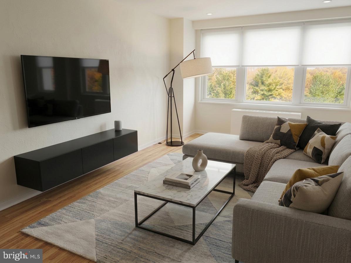 1600 Hagys Ford Road, Unit 9M Penn Valley, PA 19072 - Photo 1 of 22 a living room with furniture tv and a window