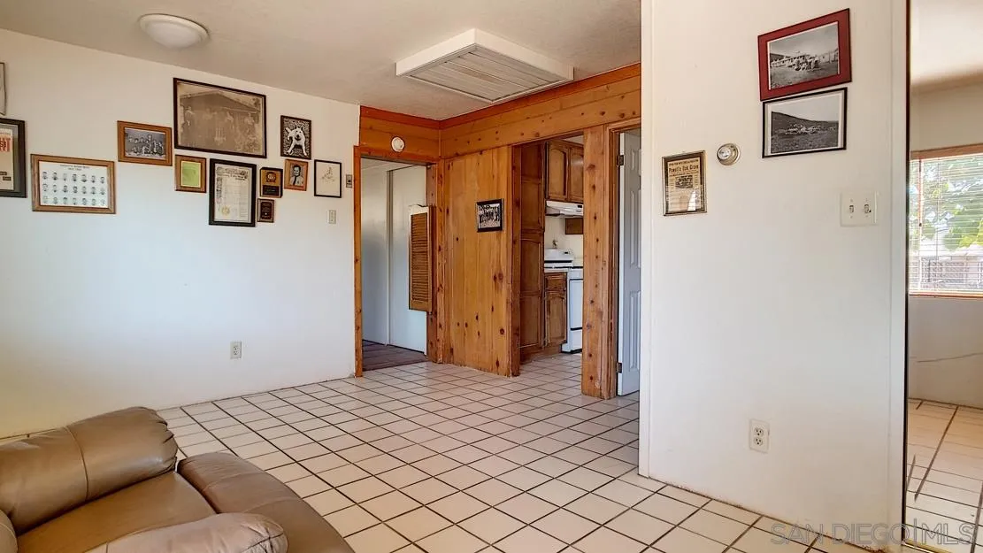3966 Willows Road Alpine, CA 91901 - Photo 11 of 14 a bedroom with a bed and cupboard