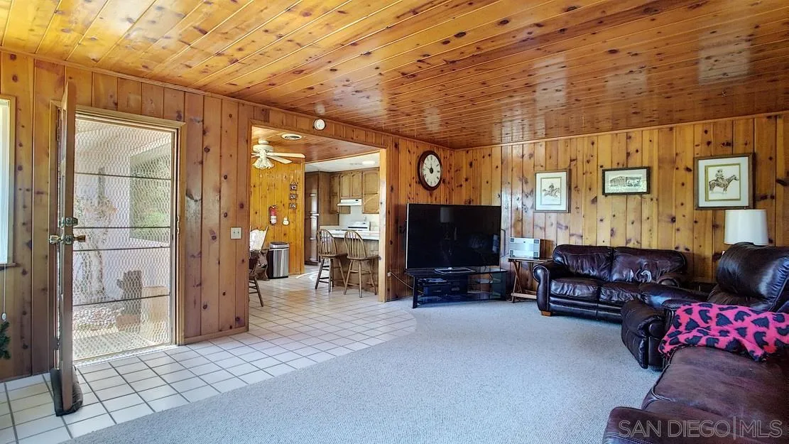 3966 Willows Road Alpine, CA 91901 - Photo 5 of 14 a living room with furniture and a flat screen tv