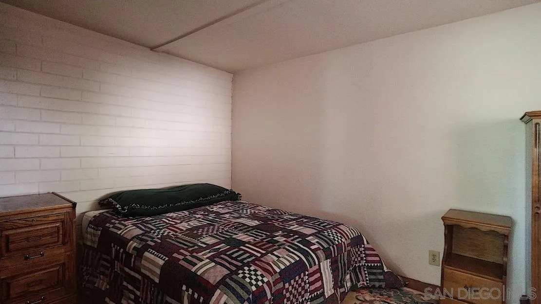 3966 Willows Road Alpine, CA 91901 - Photo 10 of 14 a bedroom with a bed and a window