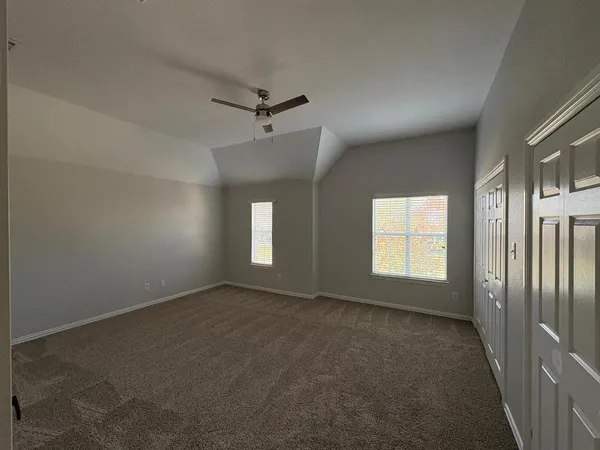 a view of an entryway door and wooden floor