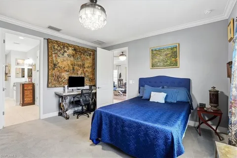 a bedroom with a bed and a desk