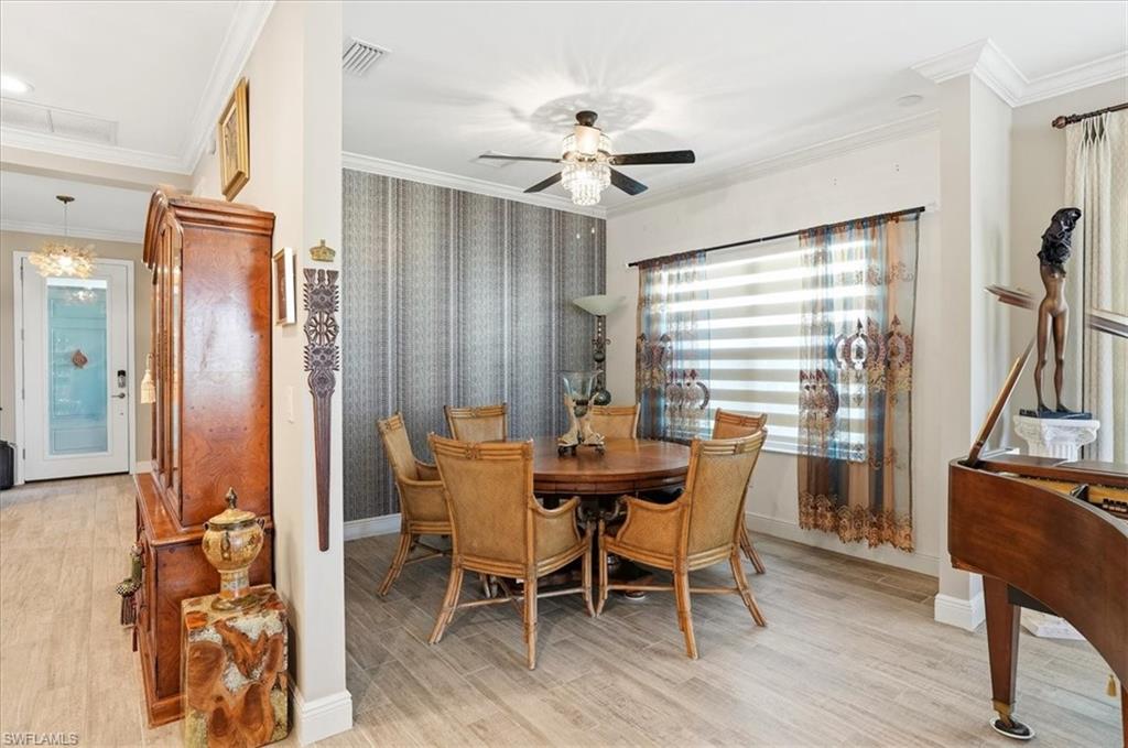 2318 Marquesa Circle Naples, FL 34112 - Photo 5 of 28 a dining room with furniture and window