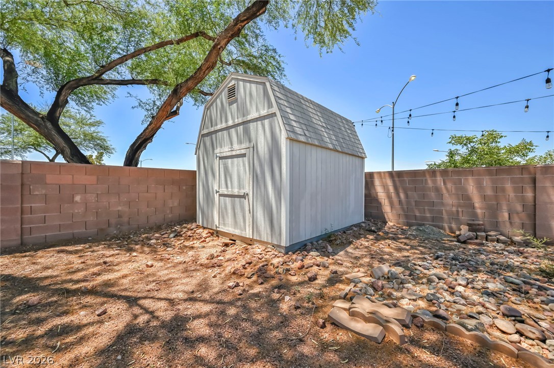 1234 Sunfire Street Henderson, NV 89014 - Photo 37 of 40 A quaint storage shed offers additional utility in the private, walled yard.