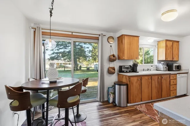 a view of a dining room with furniture window and outside view