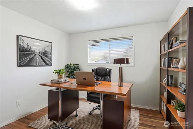 a room with furniture and a bookshelf