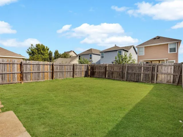 a view of a backyard with a garden