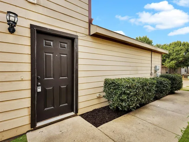 a side view of a house with garage