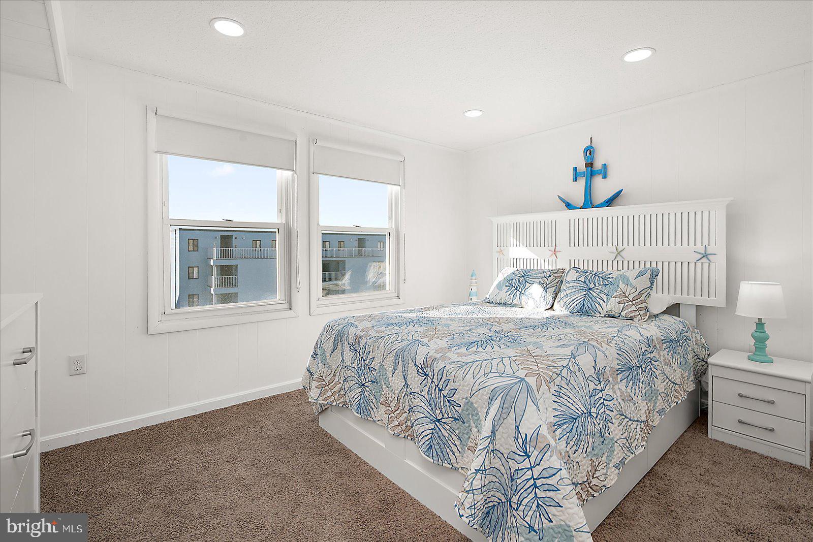 9 41st Street, Unit 320 Ocean City, MD 21842 - Photo 20 of 36 a bedroom with a bed and a window