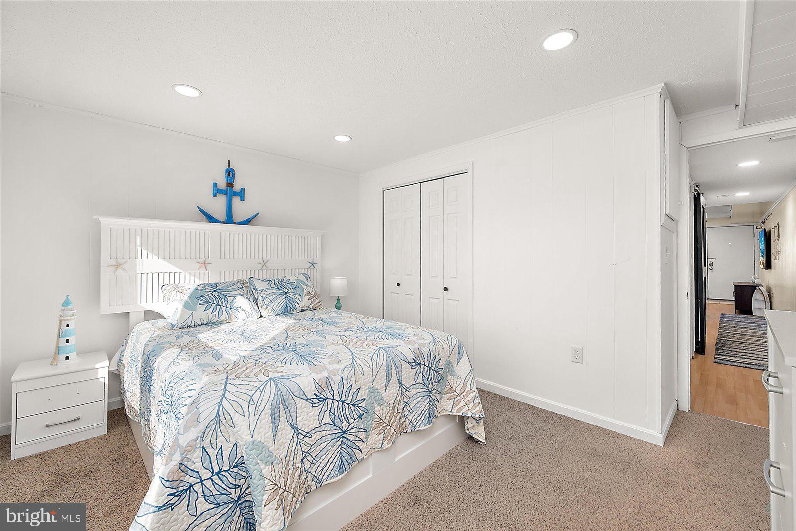 9 41st Street, Unit 320 Ocean City, MD 21842 - Photo 21 of 36 a bedroom with a bed and a view of bathroom