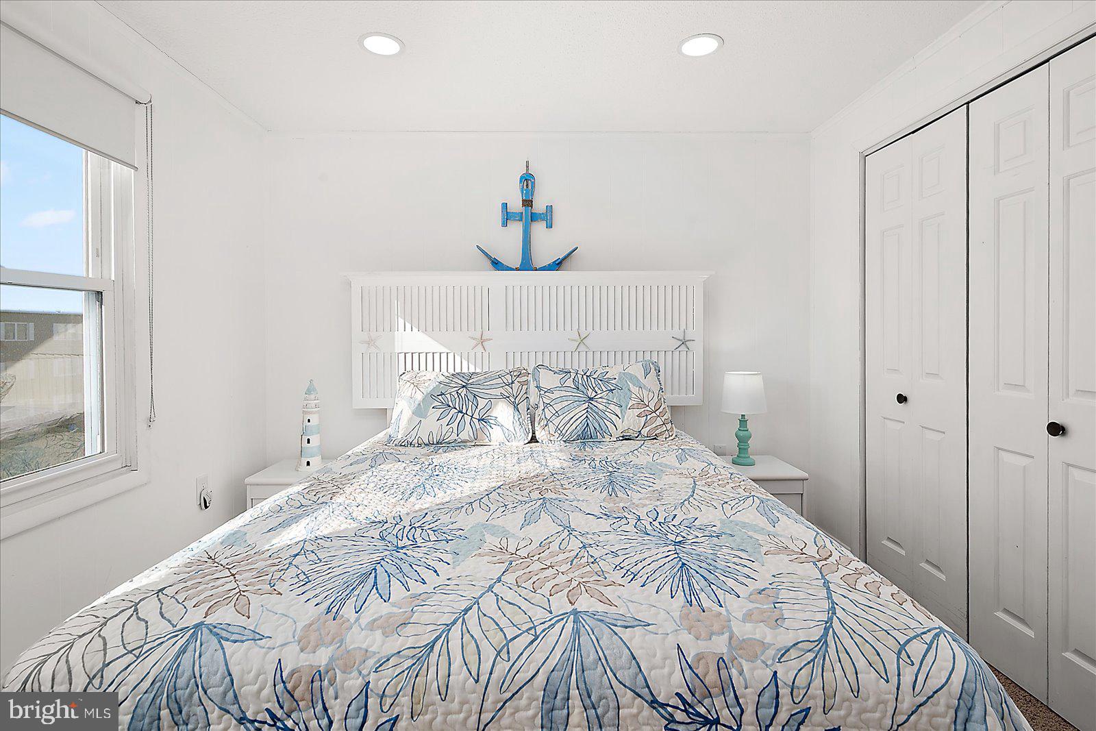 9 41st Street, Unit 320 Ocean City, MD 21842 - Photo 24 of 36 a large white bed in a white room