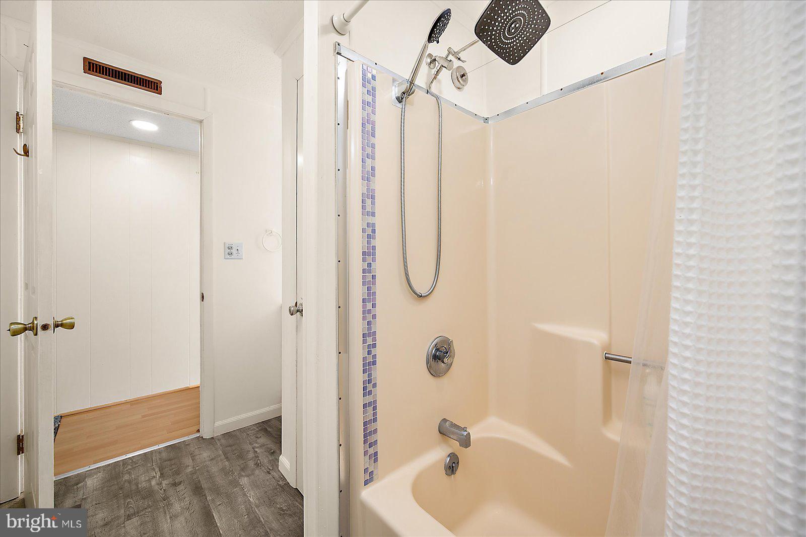 9 41st Street, Unit 320 Ocean City, MD 21842 - Photo 27 of 36 a bathroom with a shower