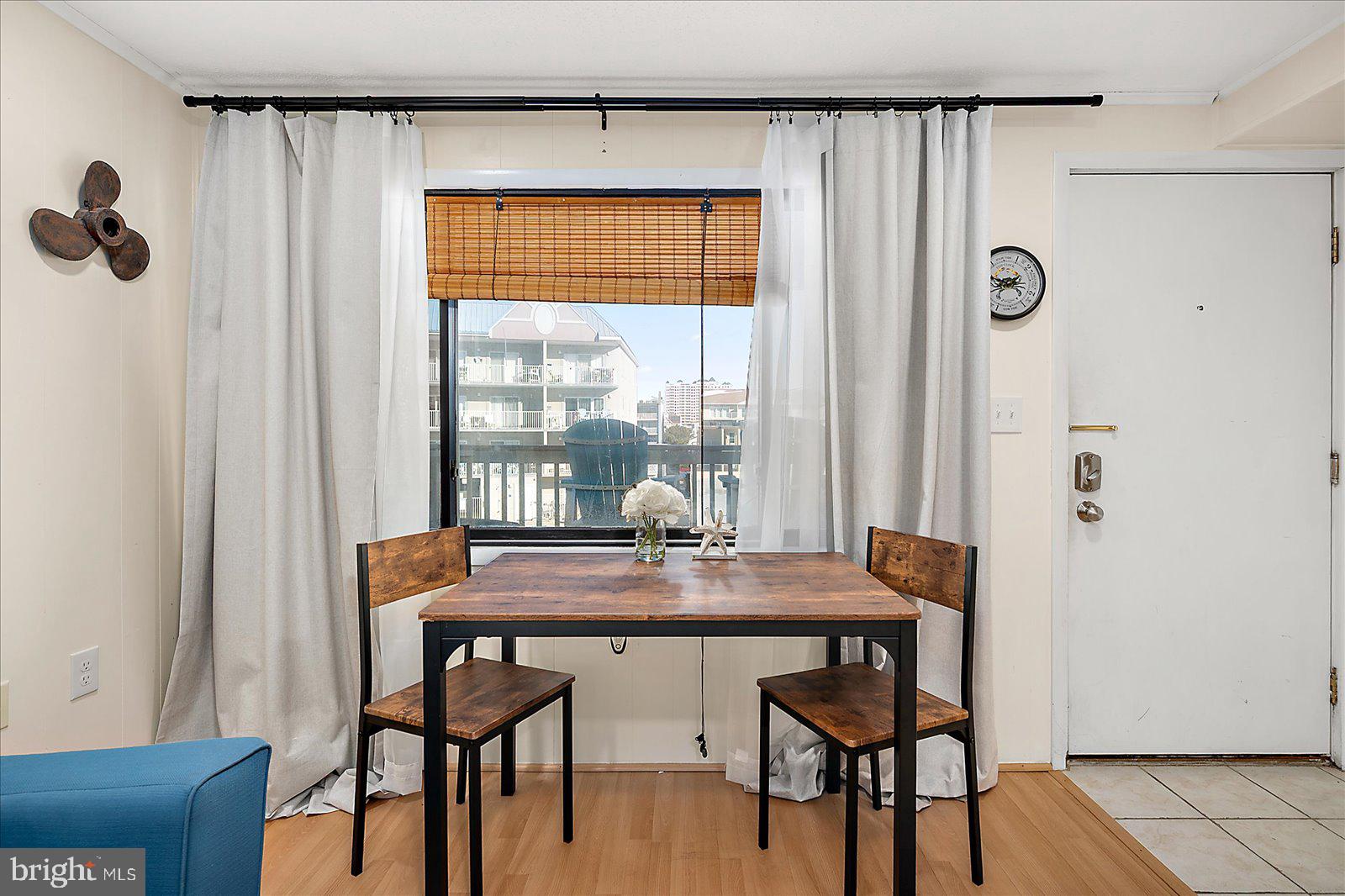 9 41st Street, Unit 320 Ocean City, MD 21842 - Photo 7 of 36 a dining room with furniture and window