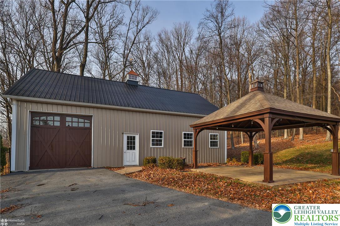 284 Walker Road Macungie, PA 18062 - Photo 13 of 99 a front view of a house with parking area