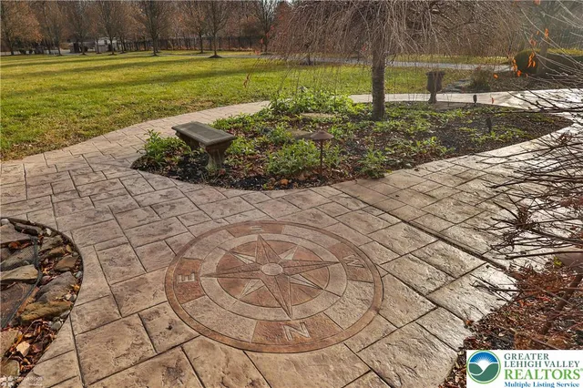 a view of an empty room with a window and a ceiling fan