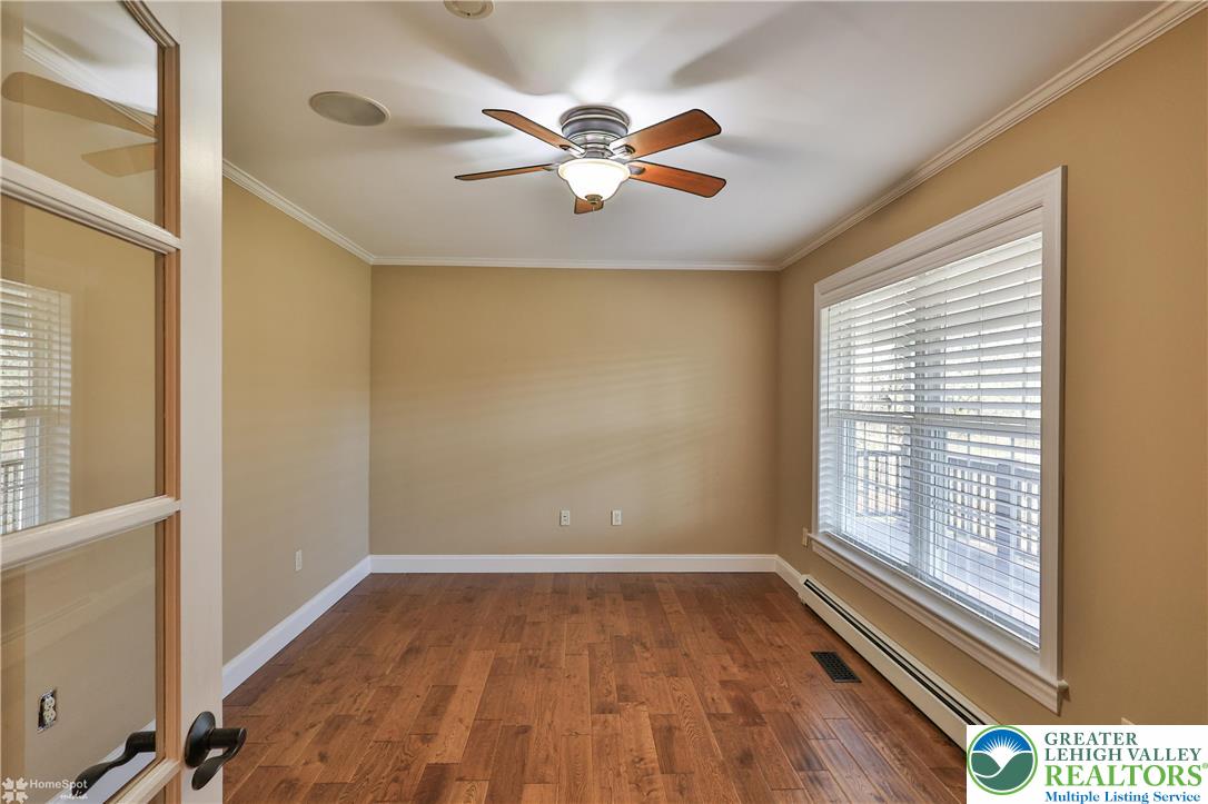 284 Walker Road Macungie, PA 18062 - Photo 32 of 99 a view of a livingroom with a ceiling fan and window