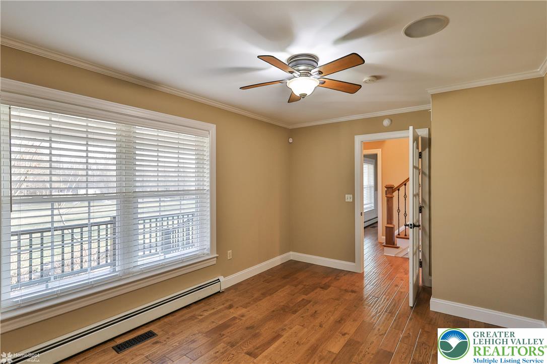 284 Walker Road Macungie, PA 18062 - Photo 33 of 99 a view of an empty room with wooden floor and a window