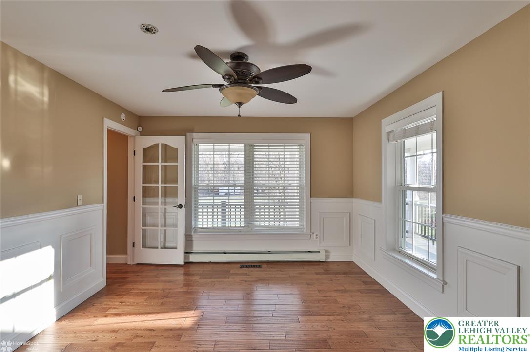 284 Walker Road Macungie, PA 18062 - Photo 34 of 99 a view of an empty room with a window and wooden floor