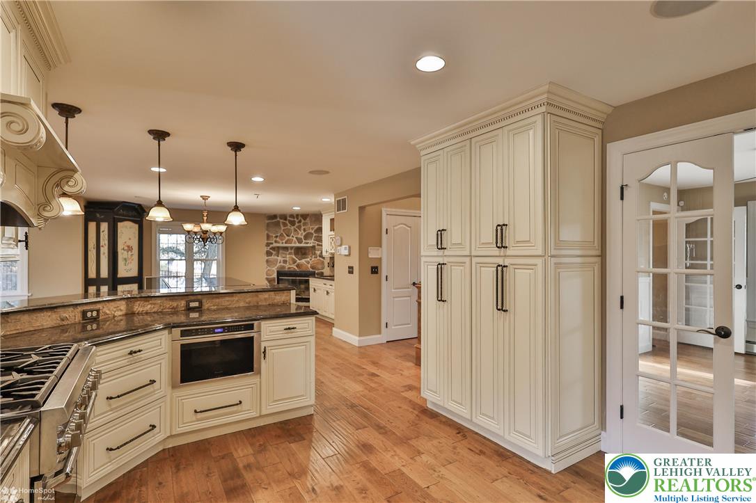 284 Walker Road Macungie, PA 18062 - Photo 44 of 99 a kitchen with stainless steel appliances granite countertop a stove and a refrigerator