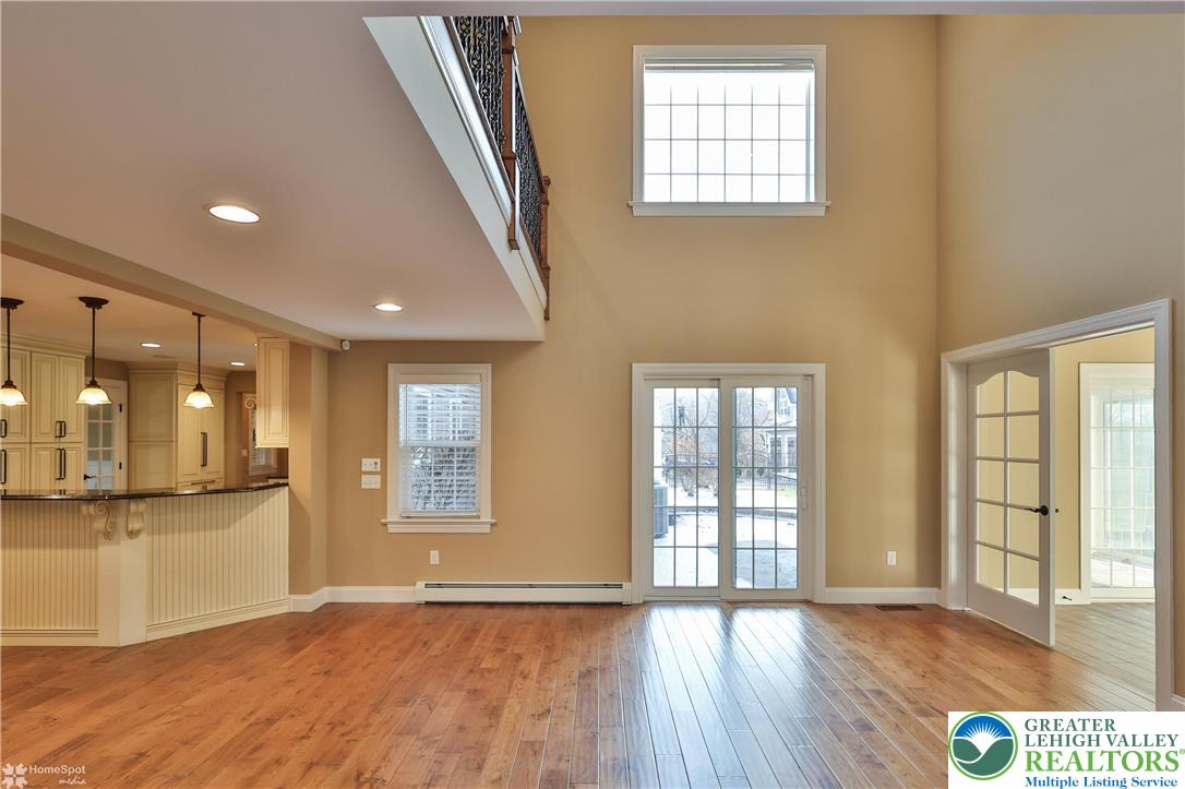 284 Walker Road Macungie, PA 18062 - Photo 49 of 99 a view of an empty room with wooden floor and a window